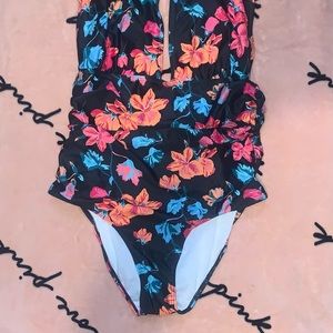Cocoship, XL, black with flowers that are peach/red with blue/green leaves